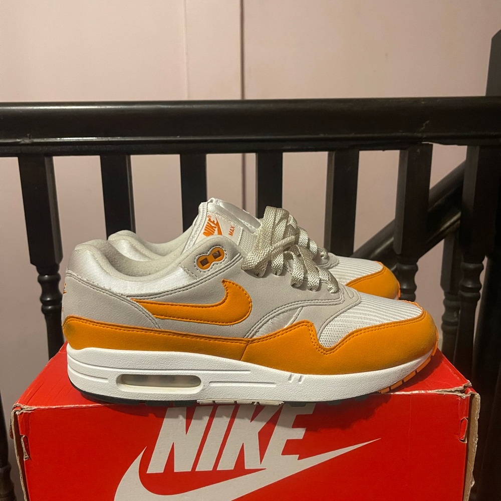 Orange Nike Air Max 1. Size 9.  Great condition. Previously loved.
